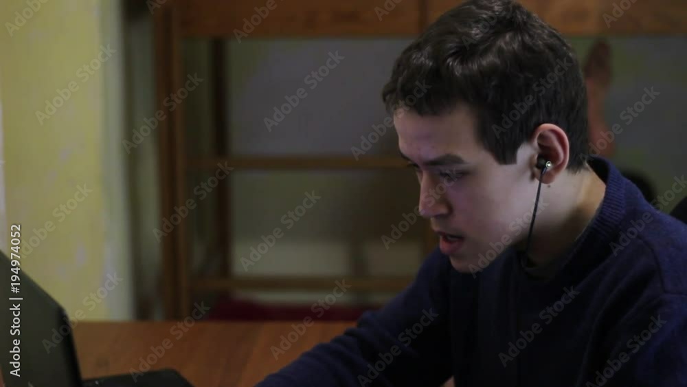 Multiplayer online battle arena. A Teen Playing A Video Game Multiplayer online battle arena. A Teen Playing A Video Game