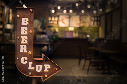 Beer clup title signboard, in front of the store . Retro style photo