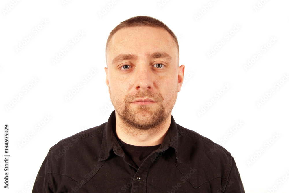 Portrait of a calm young man dressed in a black jacket Portrait of a calm young man dressed in a black jacket