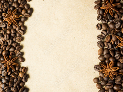 Coffee on paper background with coffee beans and star anise, copy space, top view. © Elenglush