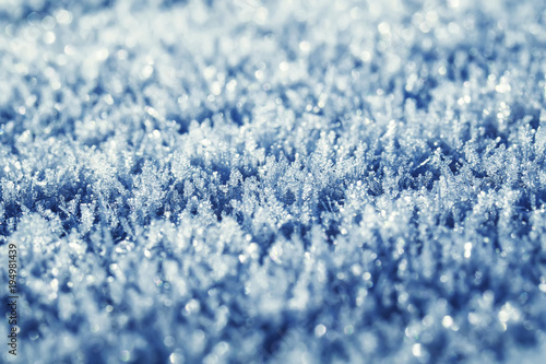 texture festive beautiful natural background of carved shiny blue frost crystals and cold ice