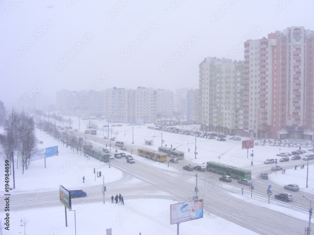 Obraz premium Urban scene after snowfall, snowy road in Minsk, Belarus
