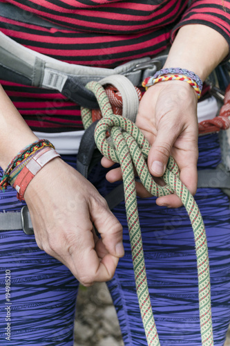 climber making a knot