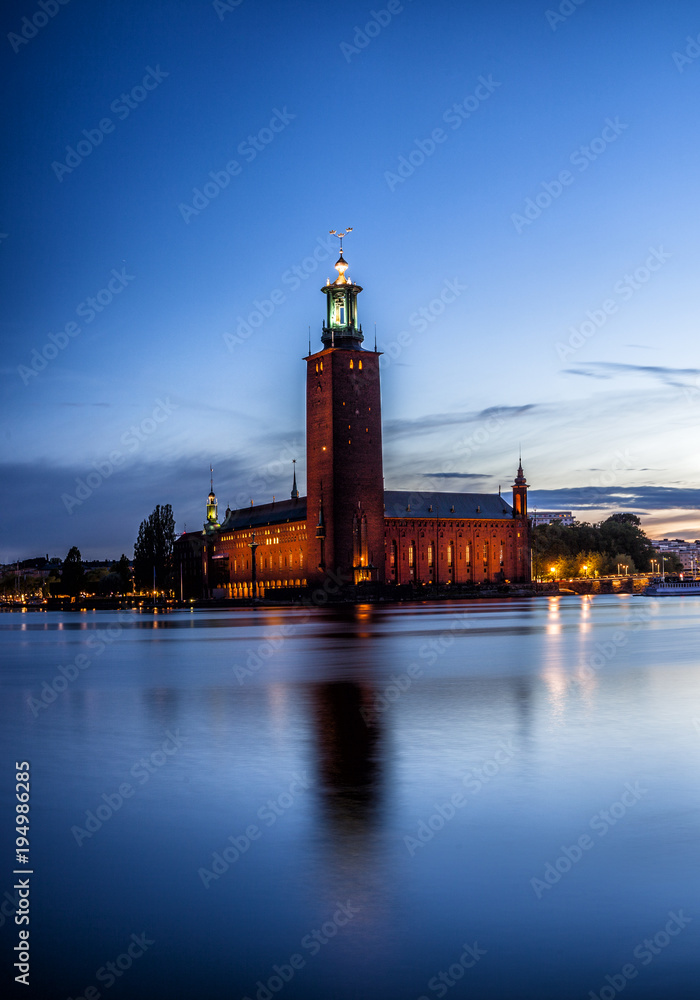 Stockholm sunset with City Hall as seen from Riddarholmen.