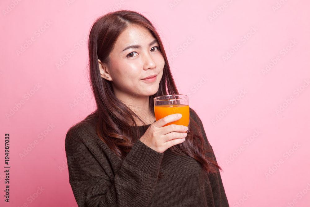 Young Asian woman drink orange juice. Young Asian woman drink orange juice.