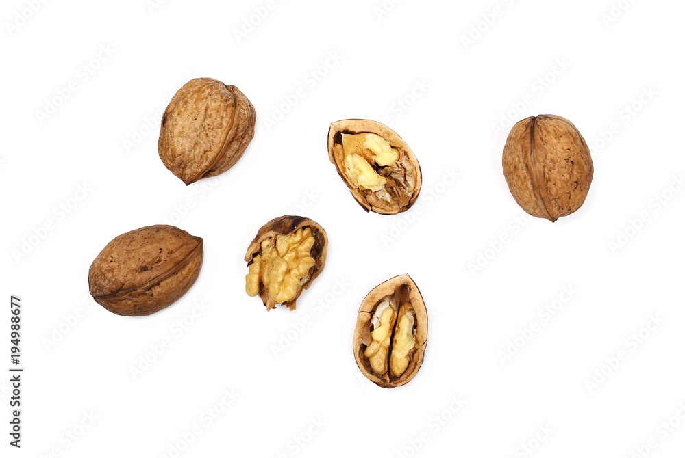 Cracked walnuts isolated on white background, top view Cracked walnuts isolated on white background, top view