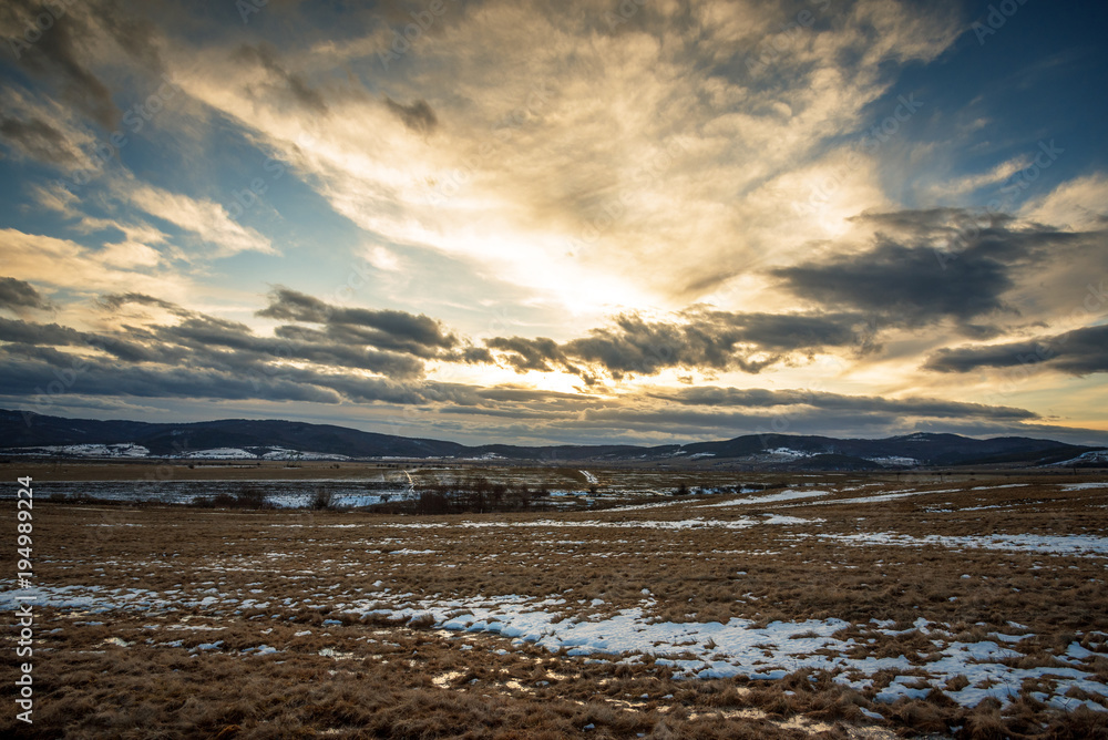 Sky and clouds in a meadow at sunset. Sky and clouds in a meadow at sunset.