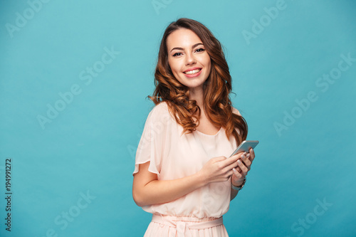 Portrait of a smiling beautiful girl wearing dress