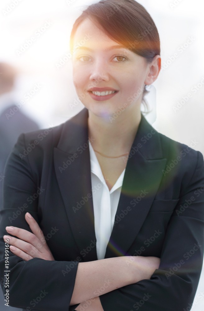 successful young business woman on the background of the office. successful young business woman on the background of the office.