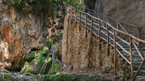 Stone staircase near waterwall in the beautiful butterfly park at Rhodes island  Greece