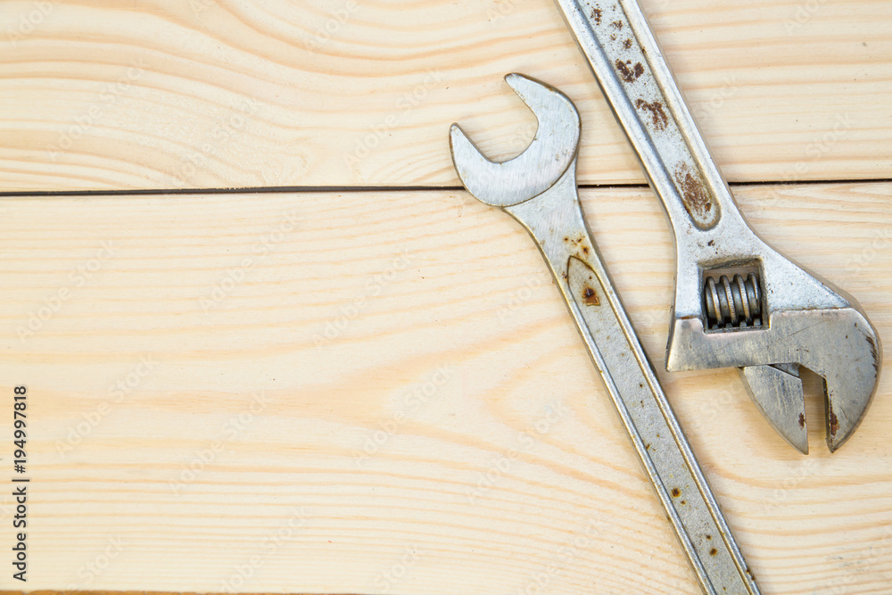 Tools for repair on light wooden background Tools for repair on light wooden background