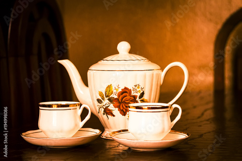 Tea Time: Beautiful teapot with two cups of tea.