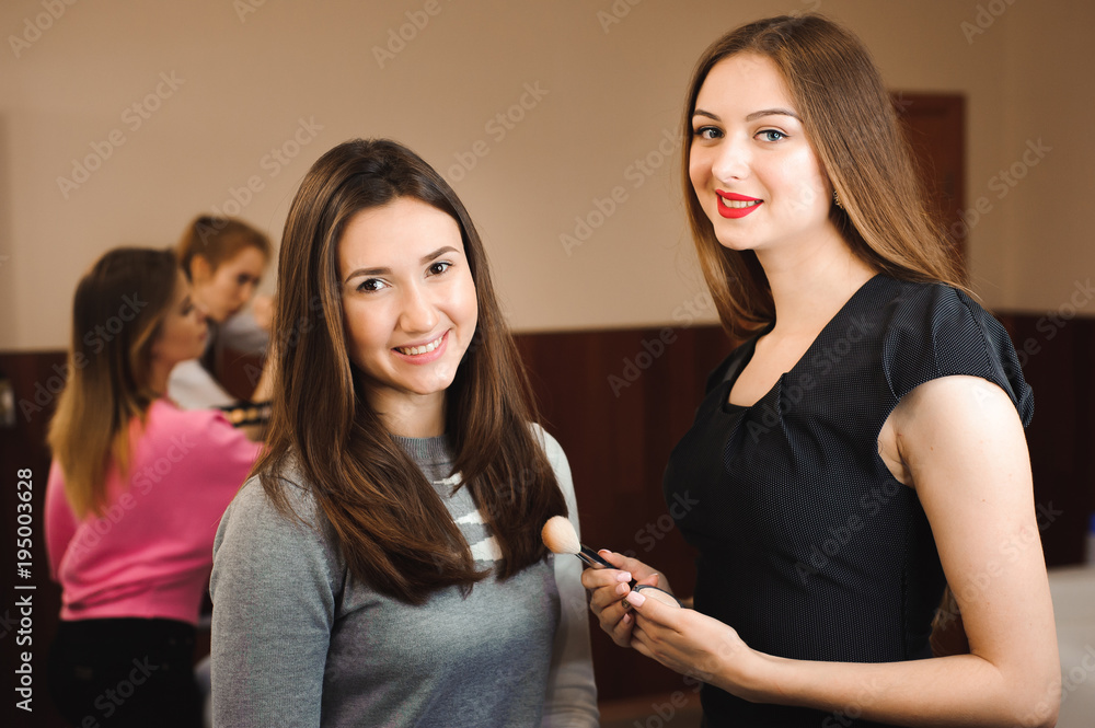 Make up artist doing professional make up of young woman. Beauty shcool. Make up artist doing professional make up of young woman. Beauty shcool.