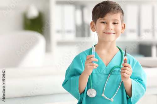 Cute little boy in doctor u...