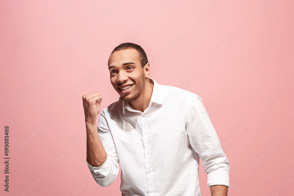 Winning success man happy ecstatic celebrating being a winner. Dynamic energetic image of male model Winning success man happy ecstatic celebrating being a winner. Dynamic energetic image of male model