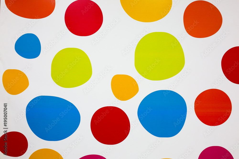 Colorful circles on the white background. Real rounds painted on the wall. Bright spheres for wall paper. Children paintings and design for room. Fun and modern. Punchy pastels. Geometry.