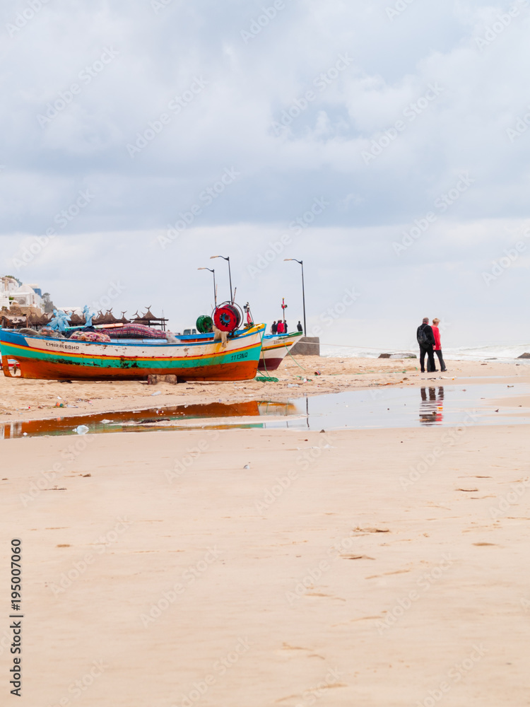 Fototapeta premium hammamet-Tunisia-city beach with people and boats in the fall
