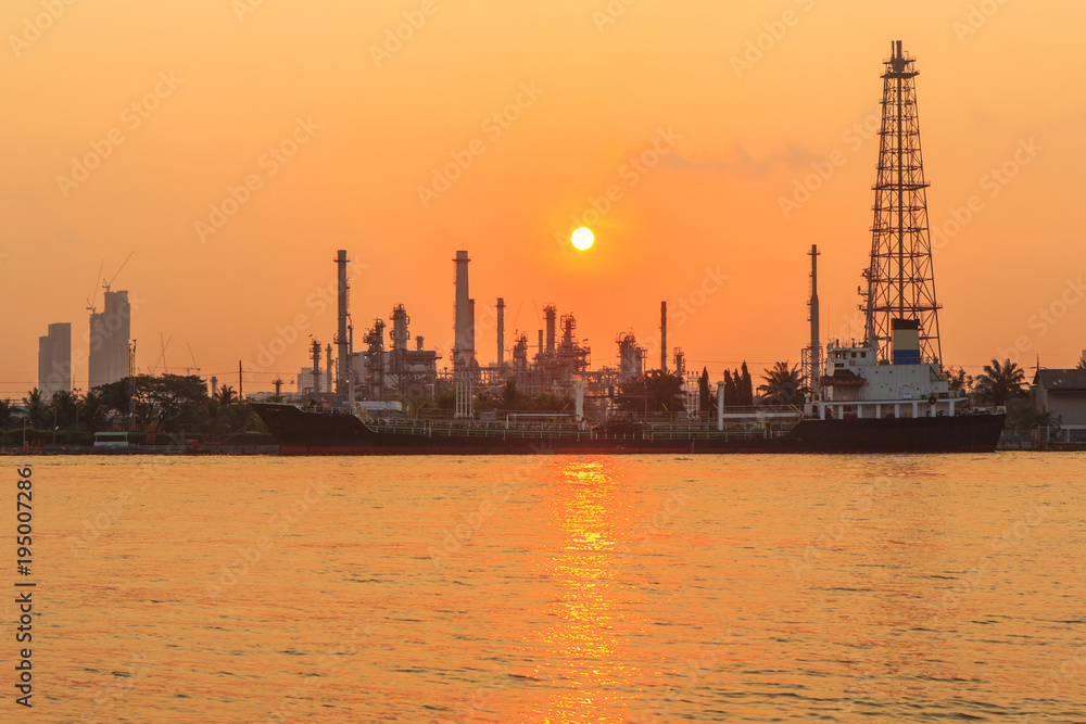 Oil refinery at the river in sunrise time / Big Factory in sunrise time