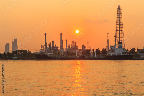 Oil refinery at the river in sunrise time / Big Factory in sunrise time © rukawajung