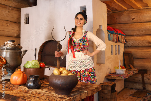 Fotografija Young woman dressed in traditional Russian clothes