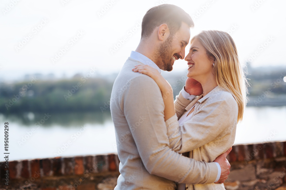 Fototapeta premium Happy couple in love hugging outdoor