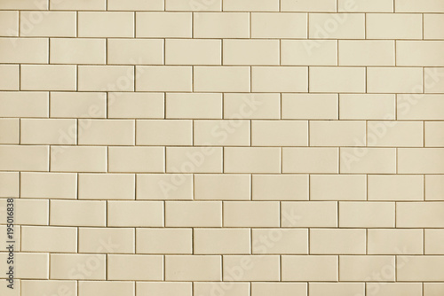 Beige tile wall background texture