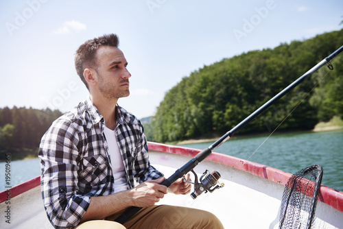 Serious men fishing in concentration
