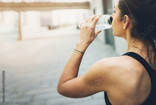 Sport woman. Rest.Drink water. Water bottle .Motivation. Sport concept