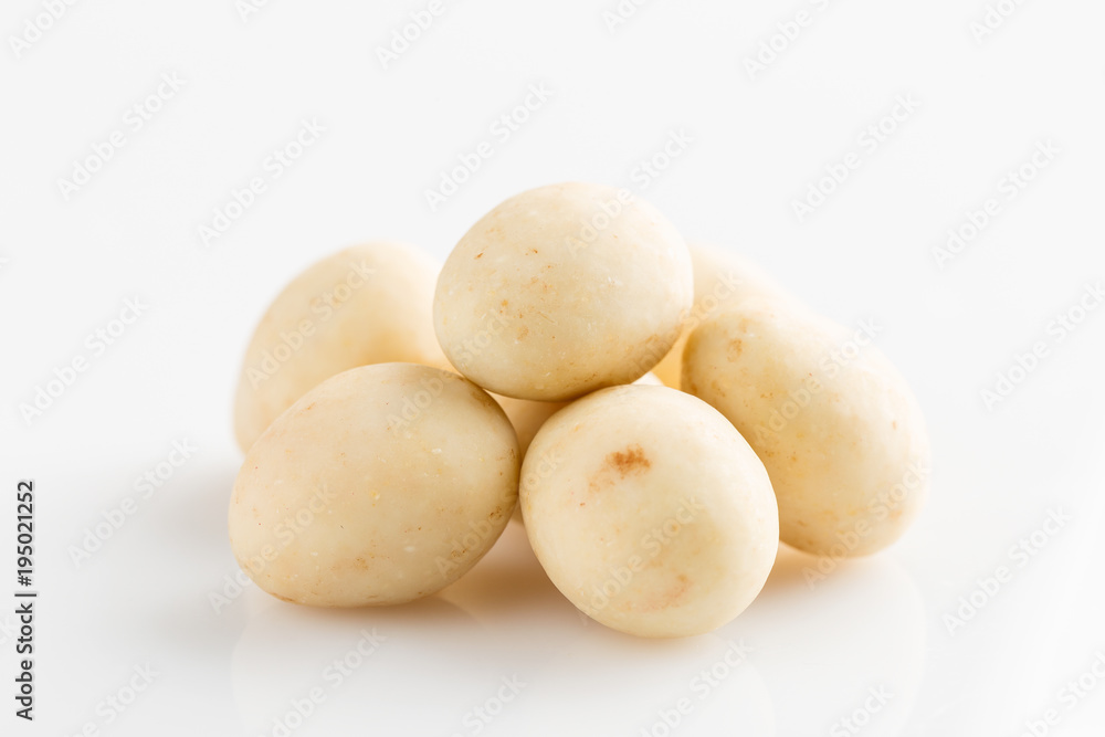 Heap of sugared almonds dragees isolated on white background Heap of sugared almonds dragees isolated on white background