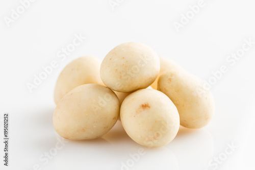 Heap of sugared almonds dragees isolated on white background