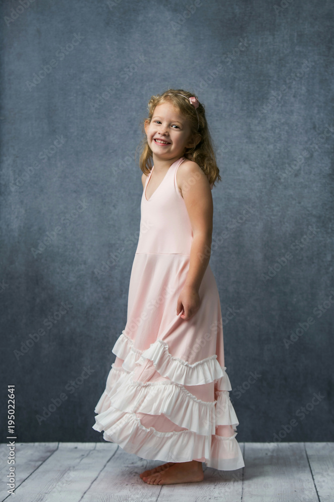 Obraz premium Happy Little Girl In Pink Twirly Dress