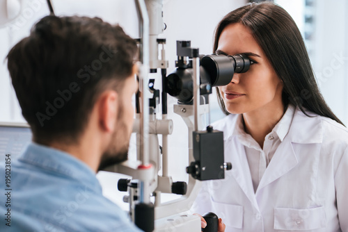 Doctor and patient in ophthalmology clinic photo