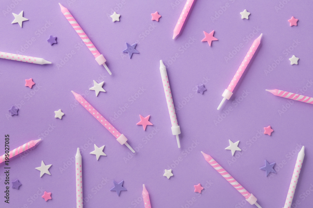 Birthday candles and stars pattern on a purple background. Birthday  background. Top view Stock Photo | Adobe Stock