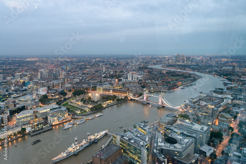 Aerial view of London Tower Bridge and skyline at night, London © jovannig