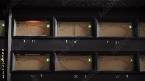 old displays of professional analog vu metres in a recording studio, measuring and showing decibels photo