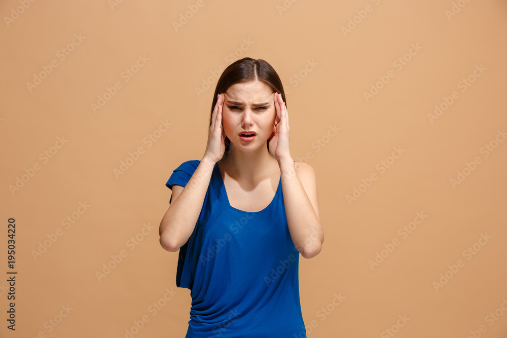 Woman having headache. Isolated over pastel background. Woman having headache. Isolated over pastel background.