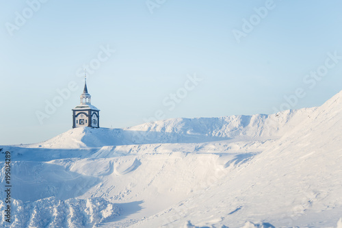 A beautiful tower of Roros church in central Norway. World heritage site. Winter town landscape. © dachux21