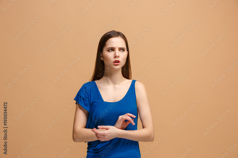 Let me think. Doubtful pensive woman with thoughtful expression making choice against pastel background Let me think. Doubtful pensive woman with thoughtful expression making choice against pastel background