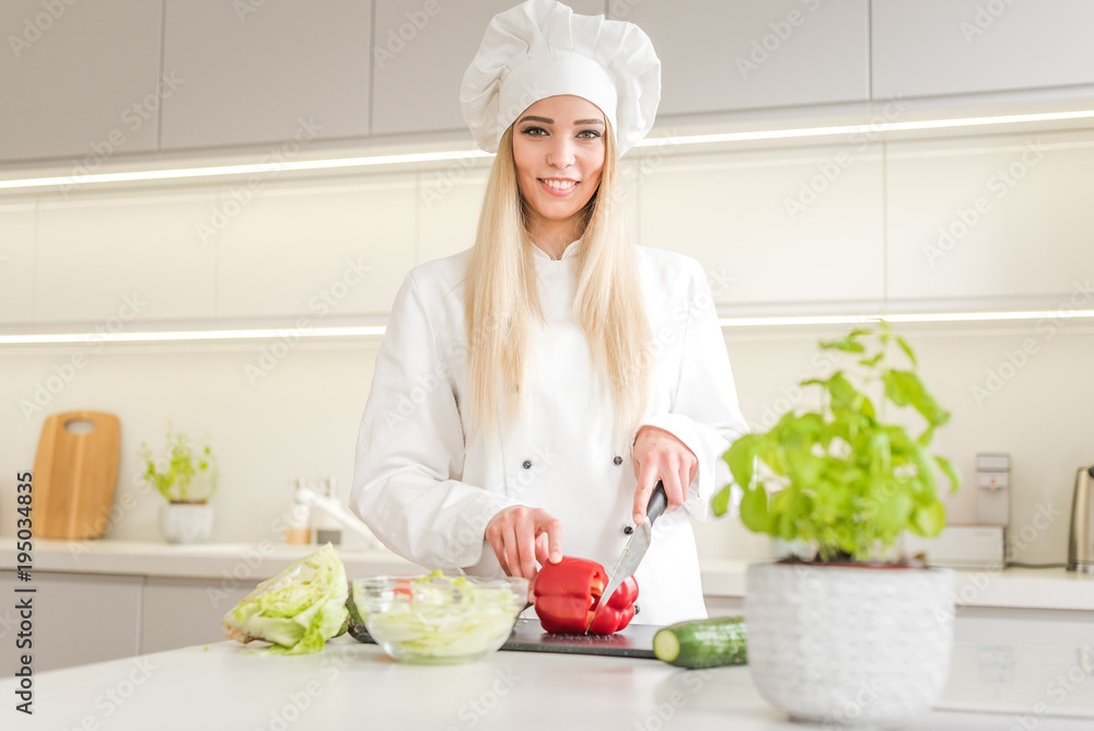 Young woman chef cooking cake in kitchen Young woman chef cooking cake in kitchen