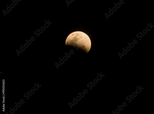 Lunar eclipse on black sky