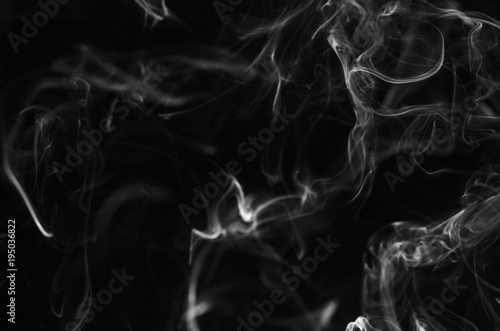 abstract movement of white smoke in dark background.