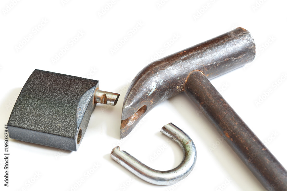 Broken padlock and claw hammer. Isolated. White background Broken padlock and claw hammer. Isolated. White background