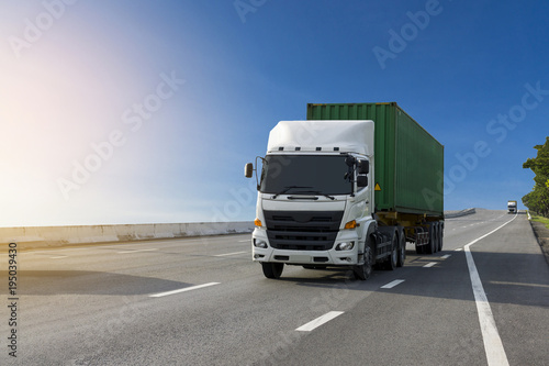 Wallpaper Mural White Truck on highway road with green  container, transportation concept.,import,export logistic industrial Transporting Land transport on the asphalt expressway with blue sky Torontodigital.ca