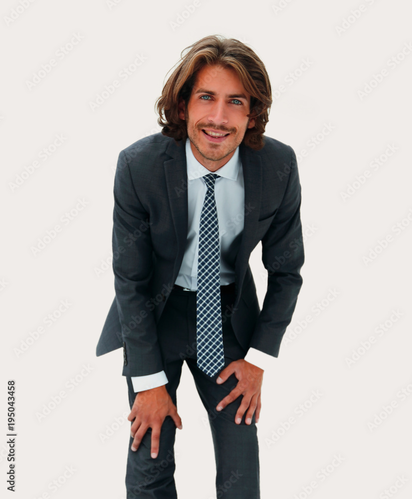 Young handsome businessman bending down. Young handsome businessman bending down.