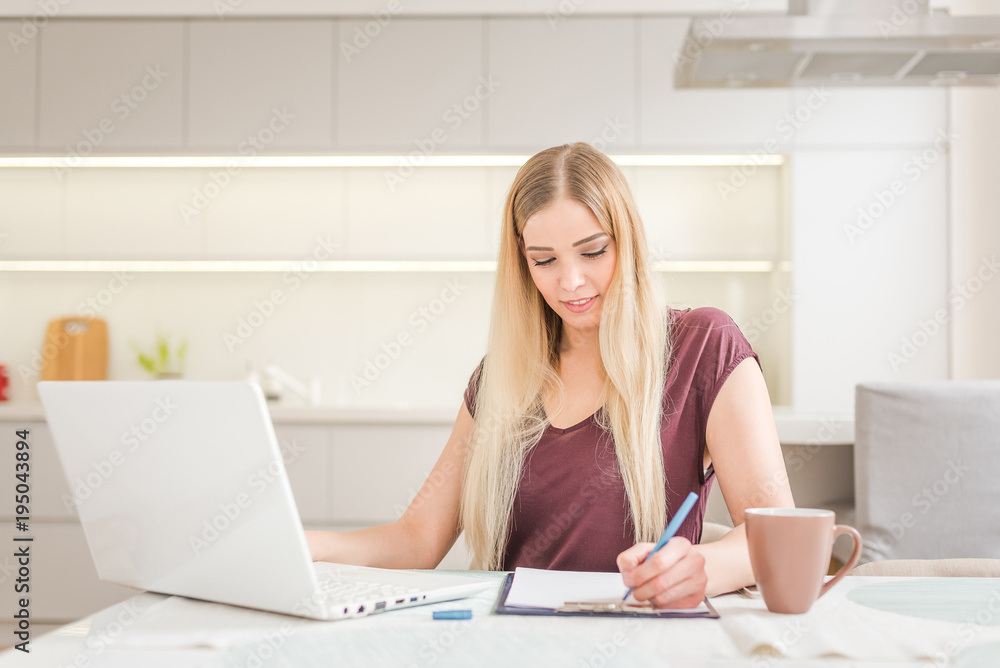 Young beautiful girl with a laptop at home Young beautiful girl with a laptop at home