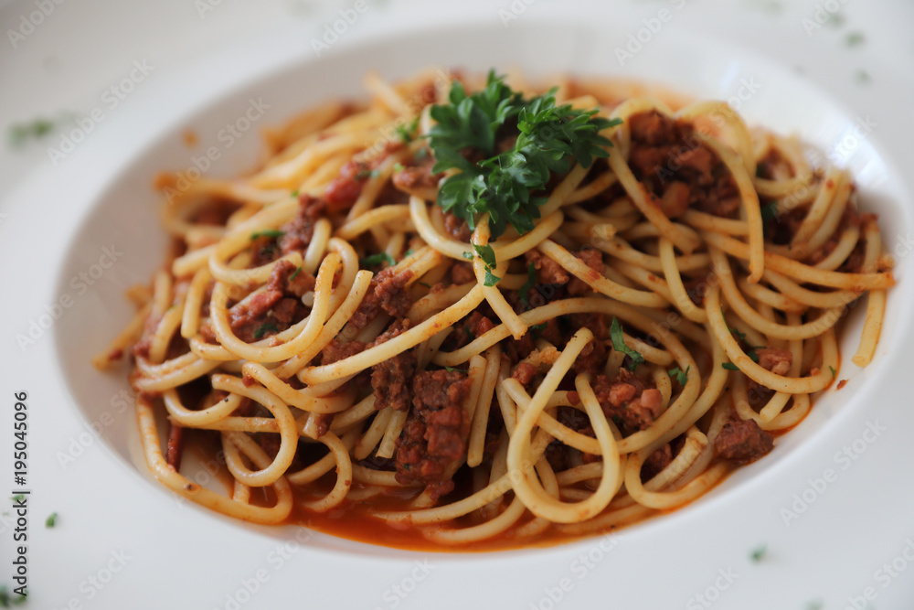 Spaghetti bolognese with beef tometo sauce on wood table , italian food