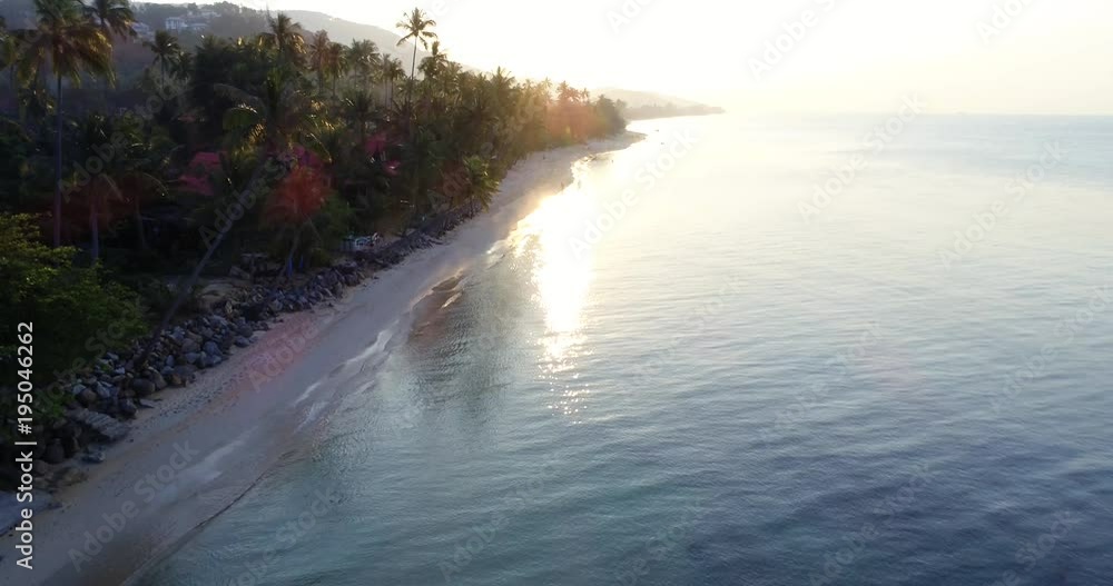 aerial drone flight into the sunset over beautiful beach in thailand, koh samui aerial drone flight into the sunset over beautiful beach in thailand, koh samui