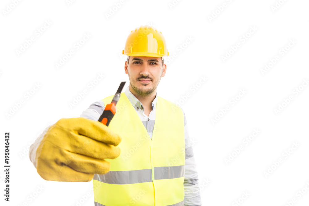 Worker holding and showing cutting tool or cutter.