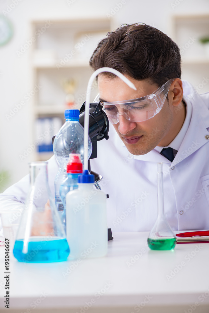 Lab assistant testing water quality Lab assistant testing water quality