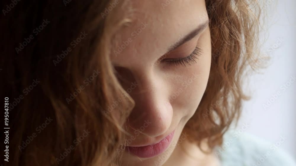 Girl looking at the phone in her hands